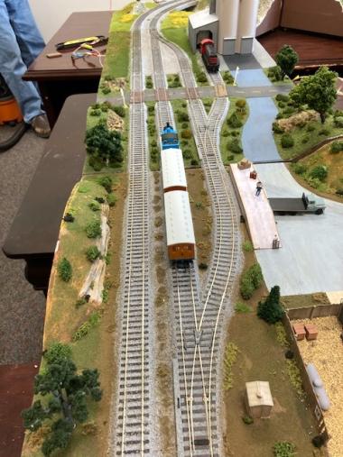 Thomas the Tank Engine, which is typically a big hit with younger railfans, is pulling 2 coaches on the modules by Ken M., Joe D. and Dave W.