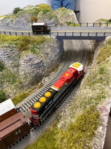 A Train travels on a corner module which was sceniced by Markus Weller.